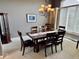 Formal dining room with elegant chandelier and plenty of space for Gathering gatherings at 5200 W Shoreline Ter, Muncie, IN 47304