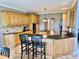 Spacious kitchen features custom wood cabinetry, black countertops, and tiled backsplash at 5200 W Shoreline Ter, Muncie, IN 47304