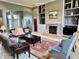 Inviting living room with fireplace, built-in shelving, and large windows at 5200 W Shoreline Ter, Muncie, IN 47304