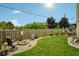 Cozy backyard with a fire pit, comfortable seating, and a lush green lawn at 5361 Cradle River Ct, Indianapolis, IN 46221