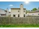 Backyard with string lights, wooden privacy fence, and grass at 5361 Cradle River Ct, Indianapolis, IN 46221