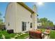 Beautiful backyard with a patio set, well-maintained lawn, and vinyl siding on the house at 5361 Cradle River Ct, Indianapolis, IN 46221