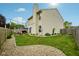 Spacious backyard with lush grass, string lights, and a well-manicured garden area at 5361 Cradle River Ct, Indianapolis, IN 46221