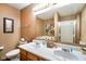 Bathroom features double sinks, and a shower with glass door, and neutral wall colors at 5361 Cradle River Ct, Indianapolis, IN 46221