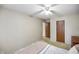 Bedroom featuring neutral walls, ceiling fan and a double door closet at 5361 Cradle River Ct, Indianapolis, IN 46221