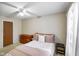 Bedroom features neutral walls, ceiling fan and a window bringing in natural light at 5361 Cradle River Ct, Indianapolis, IN 46221