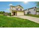 Charming two-story home features a well-manicured lawn, brick accents, and an attached two-car garage at 5361 Cradle River Ct, Indianapolis, IN 46221