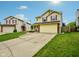 Charming two-story home features a well-manicured lawn, brick accents, and an attached two-car garage at 5361 Cradle River Ct, Indianapolis, IN 46221