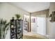 Inviting hallway featuring a display cabinet and coat closet for storing personal belongings at 5361 Cradle River Ct, Indianapolis, IN 46221