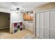 Convenient laundry room with storage cabinets and folding area, illuminated by a ceiling fan at 5361 Cradle River Ct, Indianapolis, IN 46221