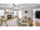 Inviting living room with a fireplace, light-filled windows, and neutral tones create a warm and welcoming space at 5361 Cradle River Ct, Indianapolis, IN 46221