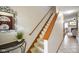 Carpeted staircase with wooden railing leading to the upper level at 5361 Cradle River Ct, Indianapolis, IN 46221