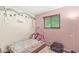 bedroom with a playful tree mural, cozy furnishings, and a creative atmosphere at 5427 Heights Ave, Indianapolis, IN 46237