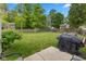 Expansive backyard with lush green grass, a fence, and patio furniture at 560 Old Farm Rd, Danville, IN 46122