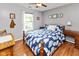 Charming bedroom with hardwood floors, a window view, and a vintage desk at 560 Old Farm Rd, Danville, IN 46122