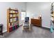 Inviting bedroom with a comfortable chair and footrest, complemented by a built-in bookshelf at 560 Old Farm Rd, Danville, IN 46122