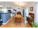 Bright dining area with hardwood floors, a chandelier, and sliding glass doors to the backyard at 560 Old Farm Rd, Danville, IN 46122