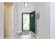 Inviting entryway features tile floors, a coat closet, and a view of the front yard through a glass door at 560 Old Farm Rd, Danville, IN 46122