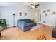 Comfortable living room with hardwood floors, a cozy gray sofa, and a ceiling fan at 560 Old Farm Rd, Danville, IN 46122