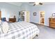 Spacious main bedroom featuring a gray and white comforter, adjoining bathroom, and ample closet space at 560 Old Farm Rd, Danville, IN 46122