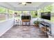 Bright sun room with plenty of windows, an aquarium, and views of the garden at 560 Old Farm Rd, Danville, IN 46122
