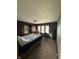 Bedroom with dark walls, built-in cabinets, and natural light, awaiting interior design and customization at 5960 Southeastern Ave, Indianapolis, IN 46203