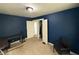 Bedroom in dark blue featuring an open closet and connecting doorway at 5960 Southeastern Ave, Indianapolis, IN 46203