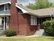 Charming brick home with a covered porch and neat front lawn at 5960 Southeastern Ave, Indianapolis, IN 46203