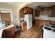 Spacious kitchen with hardwood floors, appliances, and ample cabinetry at 5960 Southeastern Ave, Indianapolis, IN 46203