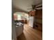 Charming kitchen featuring a vintage stove, refrigerator, wood cabinets, and ample counter space at 5960 Southeastern Ave, Indianapolis, IN 46203