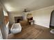 Living room with wood flooring, fireplace, and arched doorway at 5960 Southeastern Ave, Indianapolis, IN 46203