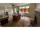 Living room featuring hardwood floors, fireplace, and arched doorway, awaiting personalization and design at 5960 Southeastern Ave, Indianapolis, IN 46203