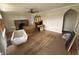 Living room features a fireplace, arched doorway, and hardwood floors awaiting personalization at 5960 Southeastern Ave, Indianapolis, IN 46203