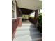 Inviting covered porch with steps, offering a cozy outdoor space at 5960 Southeastern Ave, Indianapolis, IN 46203