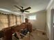 Bright room showcasing original hardwood floors, ceiling fan, and vintage details with natural light at 5960 Southeastern Ave, Indianapolis, IN 46203