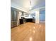 Contemporary kitchen featuring stainless steel appliances, dark cabinets, and hardwood flooring at 6143 Roberts Pl, Indianapolis, IN 46220