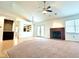 Bright, open living space featuring hardwood floors, fireplace, and seamless flow to kitchen at 6143 Roberts Pl, Indianapolis, IN 46220
