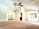 Open-concept living room with high ceilings, light hardwood floors, and views to the kitchen at 6143 Roberts Pl, Indianapolis, IN 46220