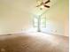 Bright main bedroom features a ceiling fan, neutral paint and large windows offering great natural light at 6143 Roberts Pl, Indianapolis, IN 46220