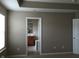 Bedroom with neutral paint and carpet flooring and an en suite bathroom at 6304 El Paso St, Whitestown, IN 46075
