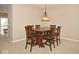 Dining room with a dark wood dining table and six chairs at 6304 El Paso St, Whitestown, IN 46075