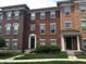 Attractive brick townhomes with well-maintained landscaping and inviting entrances at 6304 El Paso St, Whitestown, IN 46075