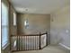 Upstairs landing featuring a window, neutral carpet and paint, and a decorative light fixture at 6304 El Paso St, Whitestown, IN 46075