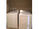Convenient laundry area features a white washer and dryer set for easy chore completion at 6304 El Paso St, Whitestown, IN 46075