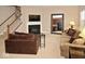 Cozy living room features a fireplace, flat screen TV, and large mirror at 6304 El Paso St, Whitestown, IN 46075