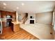 Open-concept living space with kitchen, fireplace, and staircase at 6304 El Paso St, Whitestown, IN 46075
