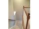 Carpeted staircase with a decorative oak and white railing at 6304 El Paso St, Whitestown, IN 46075