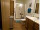 Well-lit bathroom featuring a shower, vanity with sink, and neutral color scheme at 6723 S New Jersey St, Indianapolis, IN 46227
