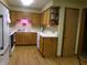 Well-lit kitchen featuring wooden cabinets and white appliances at 6723 S New Jersey St, Indianapolis, IN 46227