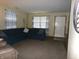 Inviting living room featuring a comfortable blue sofa and neutral decor at 6723 S New Jersey St, Indianapolis, IN 46227